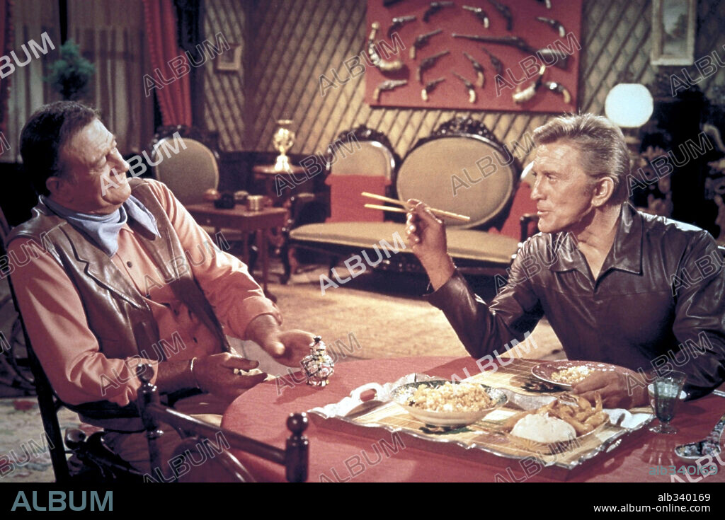 JOHN WAYNE and KIRK DOUGLAS in THE WAR WAGON, 1967, directed by BURT KENNEDY. Copyright UNIVERSAL PICTURES.