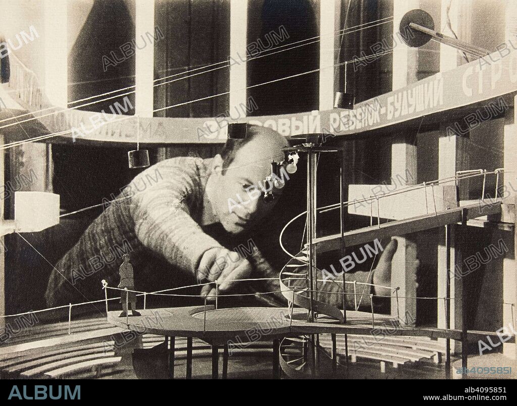 ANONYMOUS. El Lissitzky Working on a Stage Design of Sergei Tretyakov's Play "I Want a Baby" in the Meyerhold Theatre.
