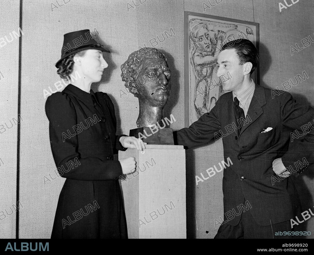At Matthiesen Gallery , New Bond Street. Mr Loris Rey , the sculptor and his bride ( Miss Moira Albery ). 4 January 1939.