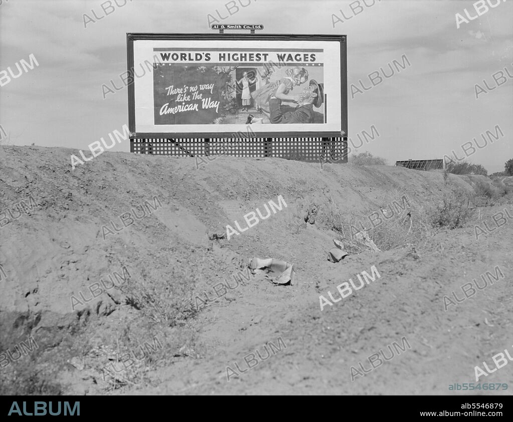 DOROTHEA LANGE. Billboard on U.S. Highway 99 in California. National advertising campaign sponsored by the National Association of Manufacturers. [White family - father returning from work during the Great Depression, a period of high unemployment: 'World's Highest Wages - There's no way like the American Way'].