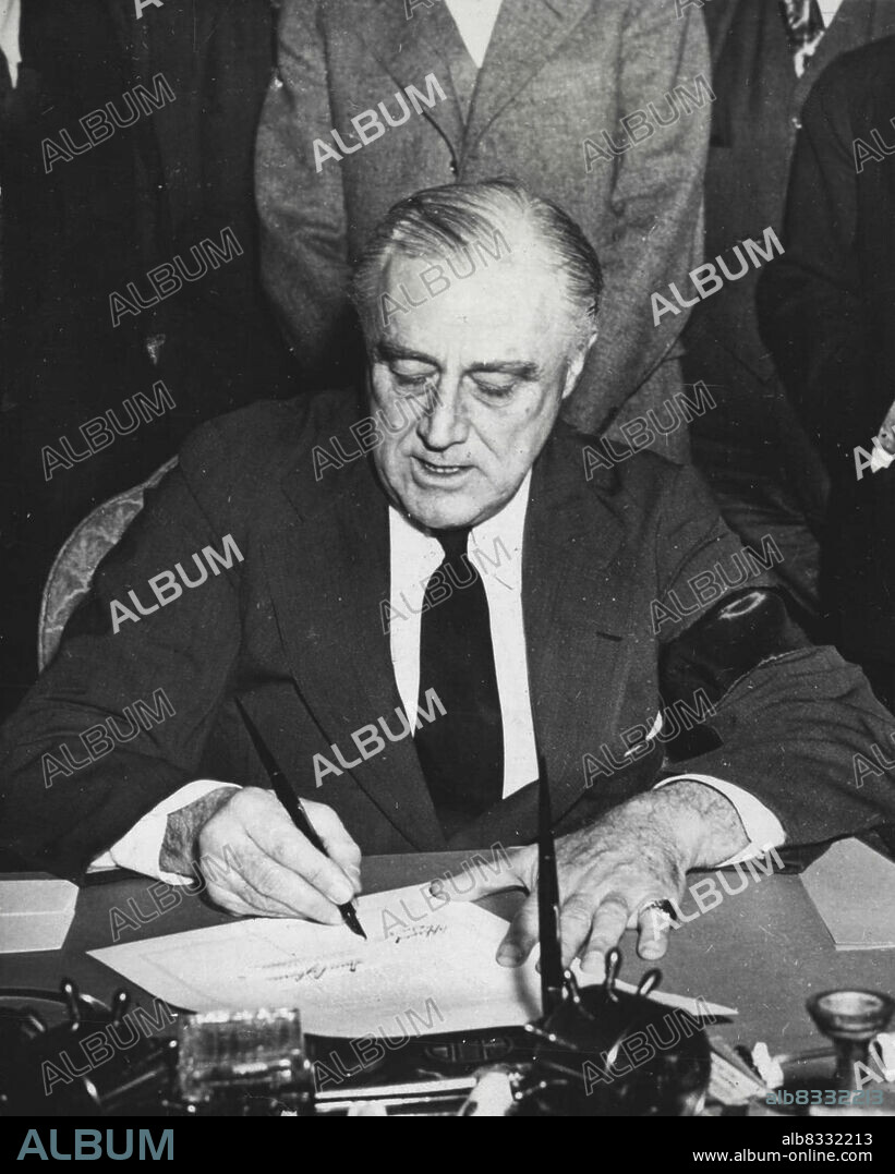 U.S. President Roosevelt Signing Declaration Of War On Japan.U.S. President Franklin D. Roosevelt signs the declaration of war on Japan they day after Japanese forces attacked Pearl Harbor, Hawaii, on December 7, 1941. He was wearing a mourning band for his mother, the late Mrs. Sara Delano Roosevelt. In accepting the Democratic Party's renomination for the U.S. Presidency on July 20, 1944, President Roosevelt stated that one of the tasks before America in 1944 is to"....form world-wide organizations and to arrange to use the armed force of the sovereign nations of the world to make be the Republican Party's nominee. April 14, 1945. (Photo by U.S. Office of War Information Picture).