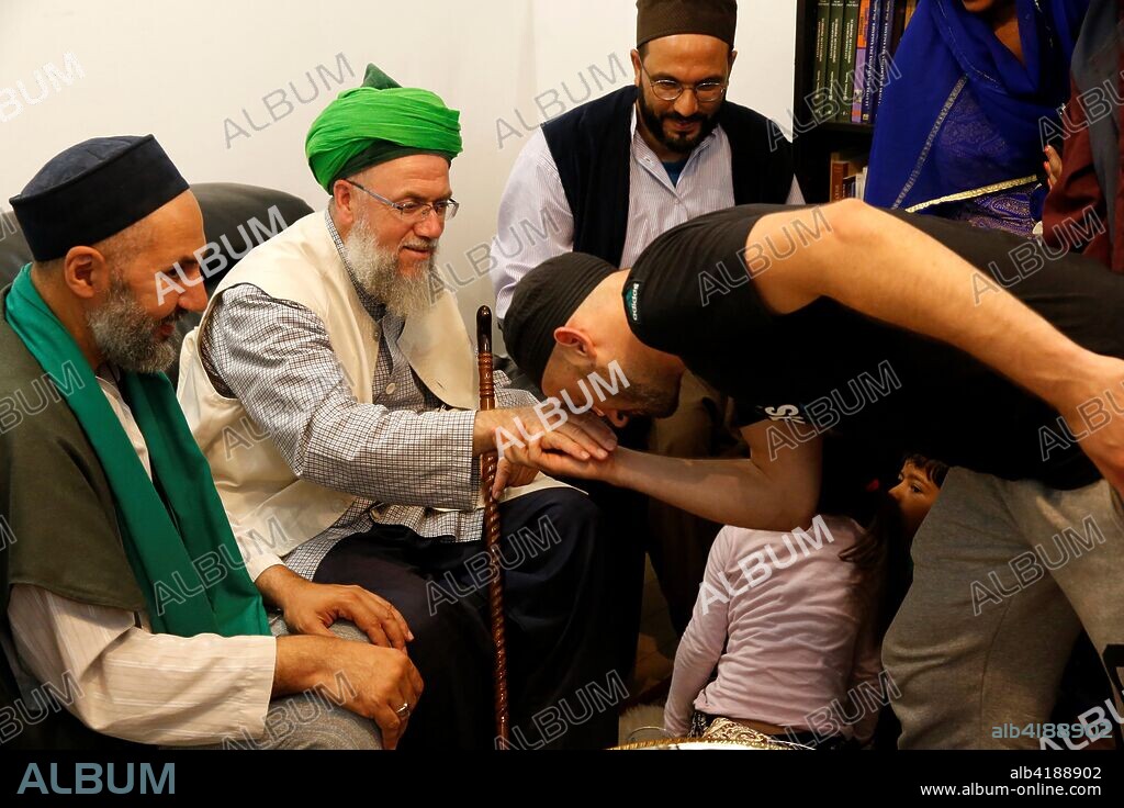 Sufi muslims with Mawlana Sheikh Mehmet Efendi in Saint-Ouen, France.
