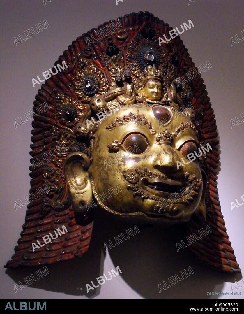 Mask of Bhairava. A destructive manifestation of Shiva. This Hindu deity was adopted by Tantric Buddhism of Tibet known as Vajrabhairava. 16th-17th century sculpture, copper encrusted, gilded and hammered.