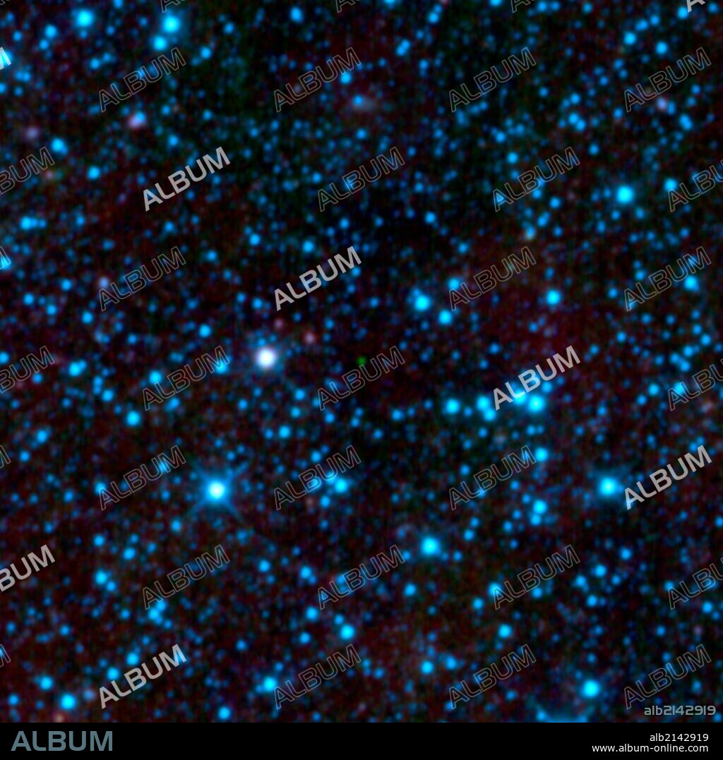 NASA's WISE has uncovered the coldest brown dwarf known so far (green dot in very center of this infrared image). Called WISE 1828+2650, this chilly star-like body isn't even as warm as a human body. (Photo by: Universal History Archive/UIG via Getty Images).