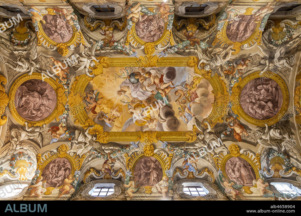 Todi, the Church of Nunziatina: the decoration of the ceiling that recalls the great Roman churches of the Baroque period, with angels, flowers and fruit among which eight medallions stand out, surrounding the main fresco, depicting episodes from the life of the Virgin.