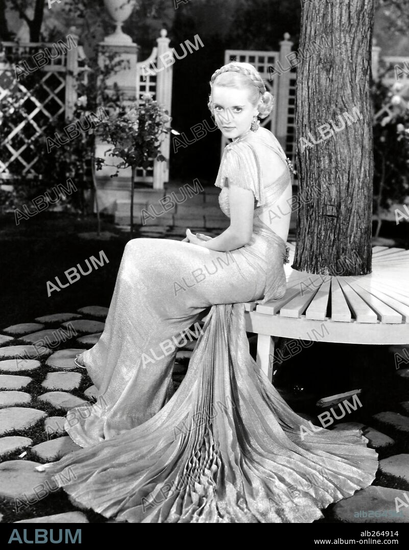 BETTE DAVIS in FASHIONS OF 1934, 1934, directed by WILHELM DIETERLE. Copyright WARNER BROTHERS. Custome by Orry-Kelly.