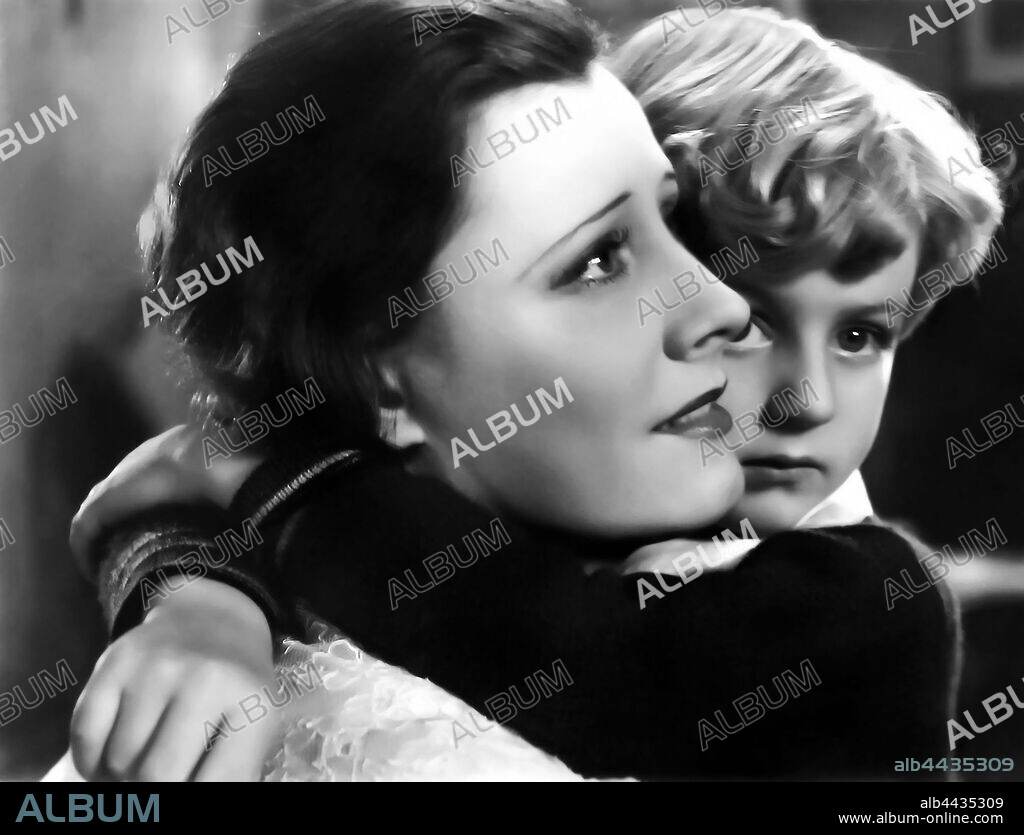 IRENE DUNNE and WALLY ALBRIGHT in THIRTEEN WOMEN, 1932, directed by GEORGE ARCHAINBAUD. Copyright RKO RADIO PICTURES.