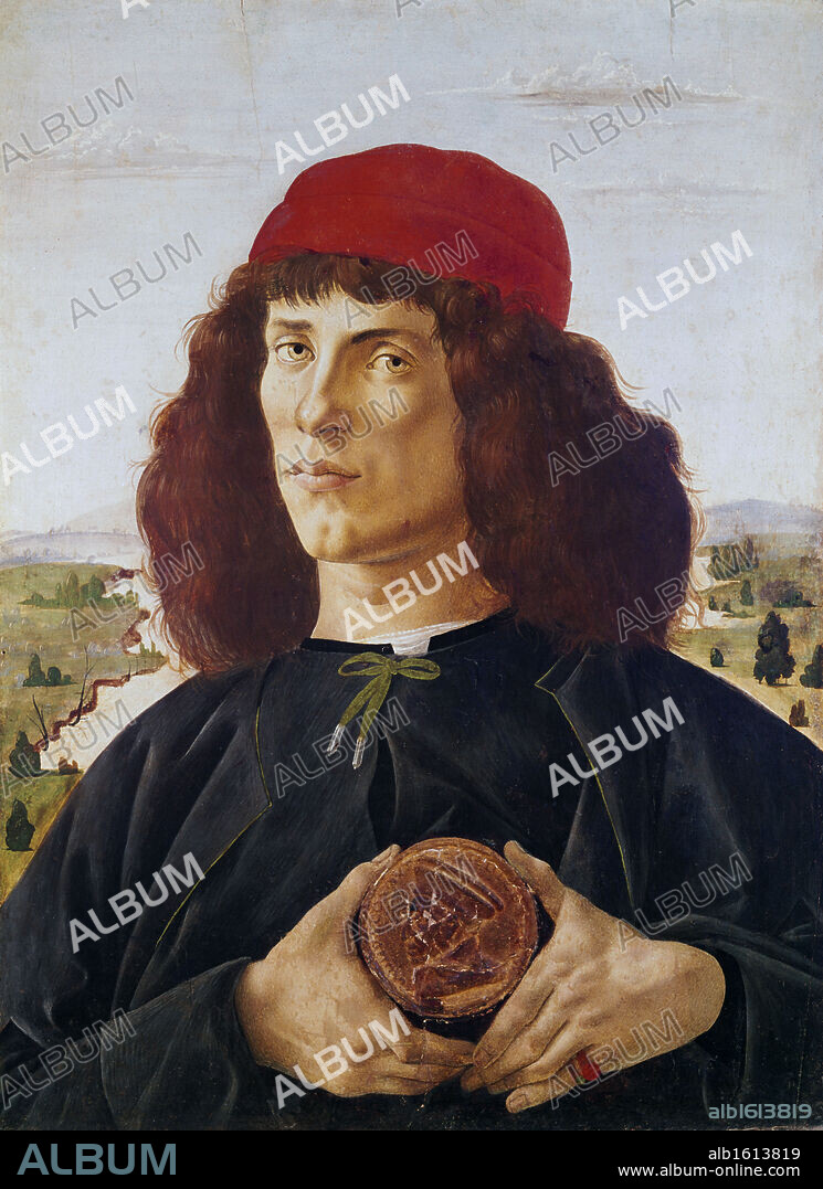 Young Man Holding A Medallion Of Cosimo De Medici c.1470 Sandro Botticelli (1444-1510 Italian) Tempera wood on Panel Galleria degli Uffizi, Florence, Italy.