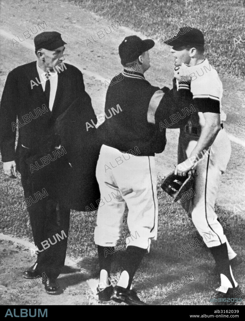 Baltimore, Maryland: May, 1963. Baltimore first baseman JIm Gentile gets collared by his manager Billy Hitchcock as he charged towards umpire Ed Runge after being ejected from the game.