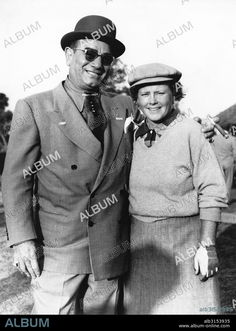 New Orleans, Louisiana:  c. 1952 Pro golfer Patty Berg meets up with New Orleans restaurateur Diamond Jim Moran at the New Orleans Women's Open golf tournament.