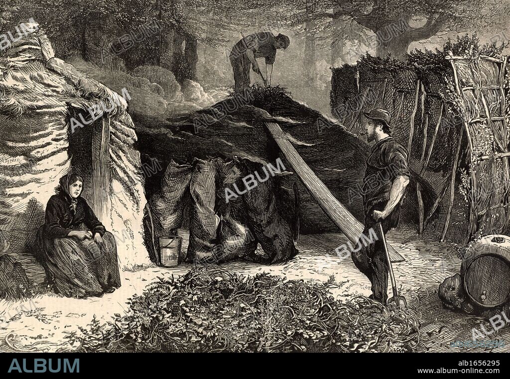 Charcoal burners in Epping Forest, Essex, near London, England. The men and their families lived in the forest for the summer so that they could be on hand to attend the burning clamps whenever necessary. On the left a woman sits on a log outside the rough hut which would be her summer home. On the right is a screen to regulate the draught. Engraving from "The Illustrated London News" (London, 8 November 1879). (Photo by: Universal History Archive/UIG via Getty Images).