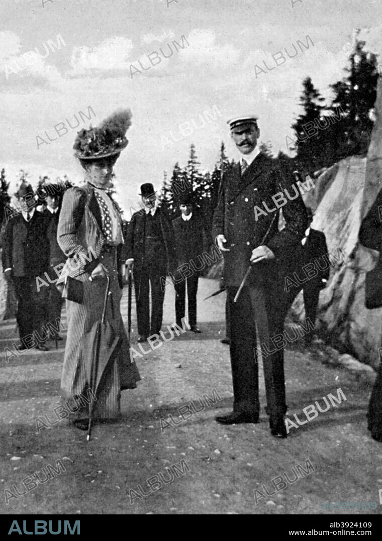 King Haakon VII of Norway (1872-1957) with his wife Queen Maud (869-1938), 1908. Haakon ruled  in Norway for 52 years. Born a prince of Denmark, he ascended to the throne in 1905 after the union with Sweden was brought to an end. He was the second son of Queen Alexandra's brother Frederick (later Frederick VIII of Denmark). Having originally been known as Prince Carl, he was always called Charles by members of the British royal family. He married his cousin Maud, the youngest daughter of Edward and Alexandra, in 1896. From Queen Alexandra's Christmas Gift Book, Photographs from My Camera, by Queen Alexandra, published by The Daily Telegraph (London, 1908).