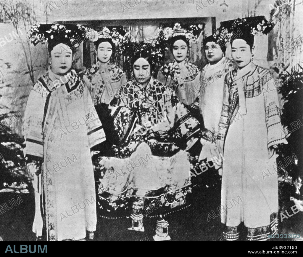 The Dowager Empress of China, 1904. The Dowager Empress Cixi (1835-1908) was regent and de facto ruler of China from 1861 until her death, even though her nephew, the Guangxu Emperor, was nominally on the throne from 1875. His wife, the Empress Xiao Ding Jing (1868-1913) is standing in front of the Dowager Empress. A print from The Girl's Own Annual, 12 November 1904.