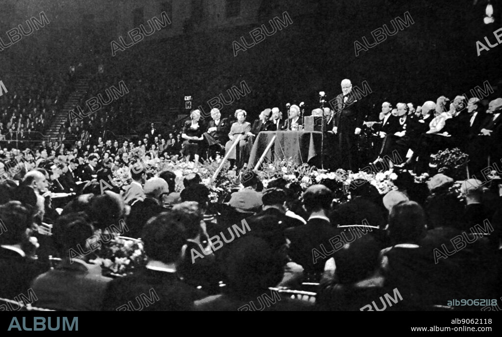 Winston Churchill speaking at Earls Court, London. Sir Winston Leonard Spencer Churchill, KG, OM, CH, TD, DL, FRS, RA (30 November 1874 - 24 January 1965) was a British statesman who served as Prime Minister of the United Kingdom from 1940 to 1945, during the Second World War, and again from 1951 to 1955. Best known for his wartime leadership as Prime Minister, Churchill was also a Sandhurst-educated soldier, a Nobel Prize-winning writer and historian, a prolific painter, and one of the longest-serving politicians in British history. Clement Richard Attlee, 1st Earl Attlee, KG, OM, CH, PC, FRS (3 January 1883 - 8 October 1967) was a British politician who served as Prime Minister of the United Kingdom from 1945 to 1951 and Leader of the Labour Party from 1935 to 1955. He was Deputy Prime Minister during the wartime coalition government under Winston Churchill, and served twice as Leader of the Opposition from 1935 to 1940 and from 1951 to 1955.