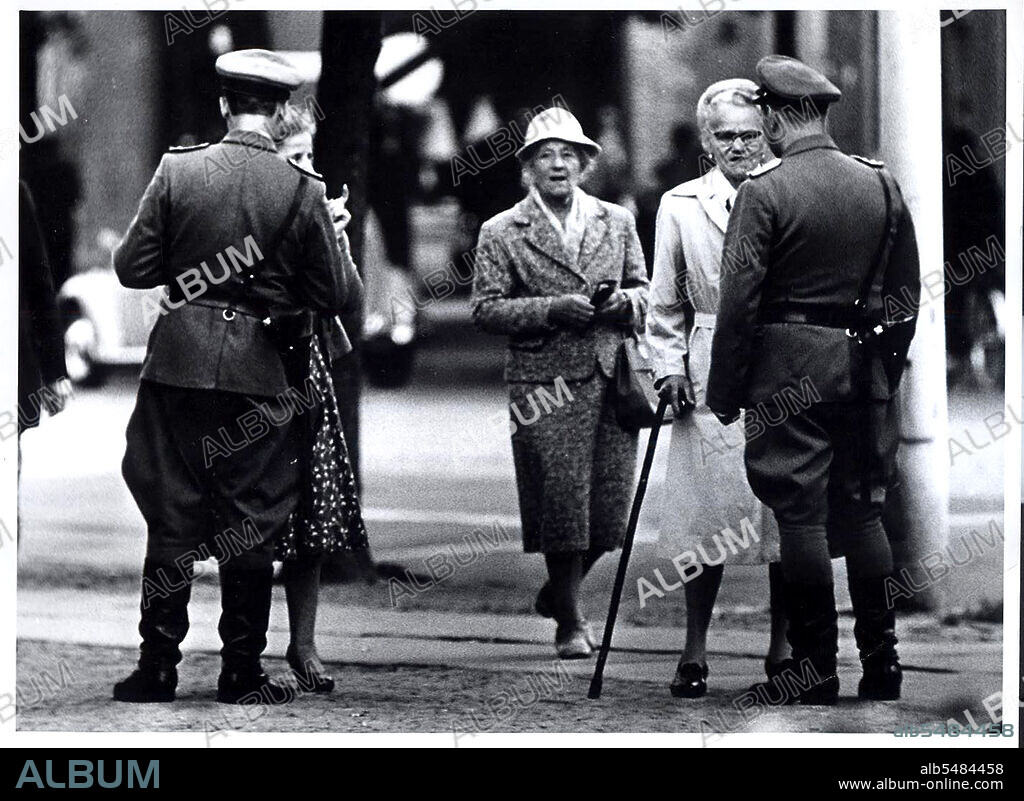 Berlin Wall Photo -  August 1961 - Two 'Vopos' (East German Police) Check East Berliners Seeking to Pass From Brandenburg Gate to Potsdamerplatz Along The Guarded Border of West Berlin.