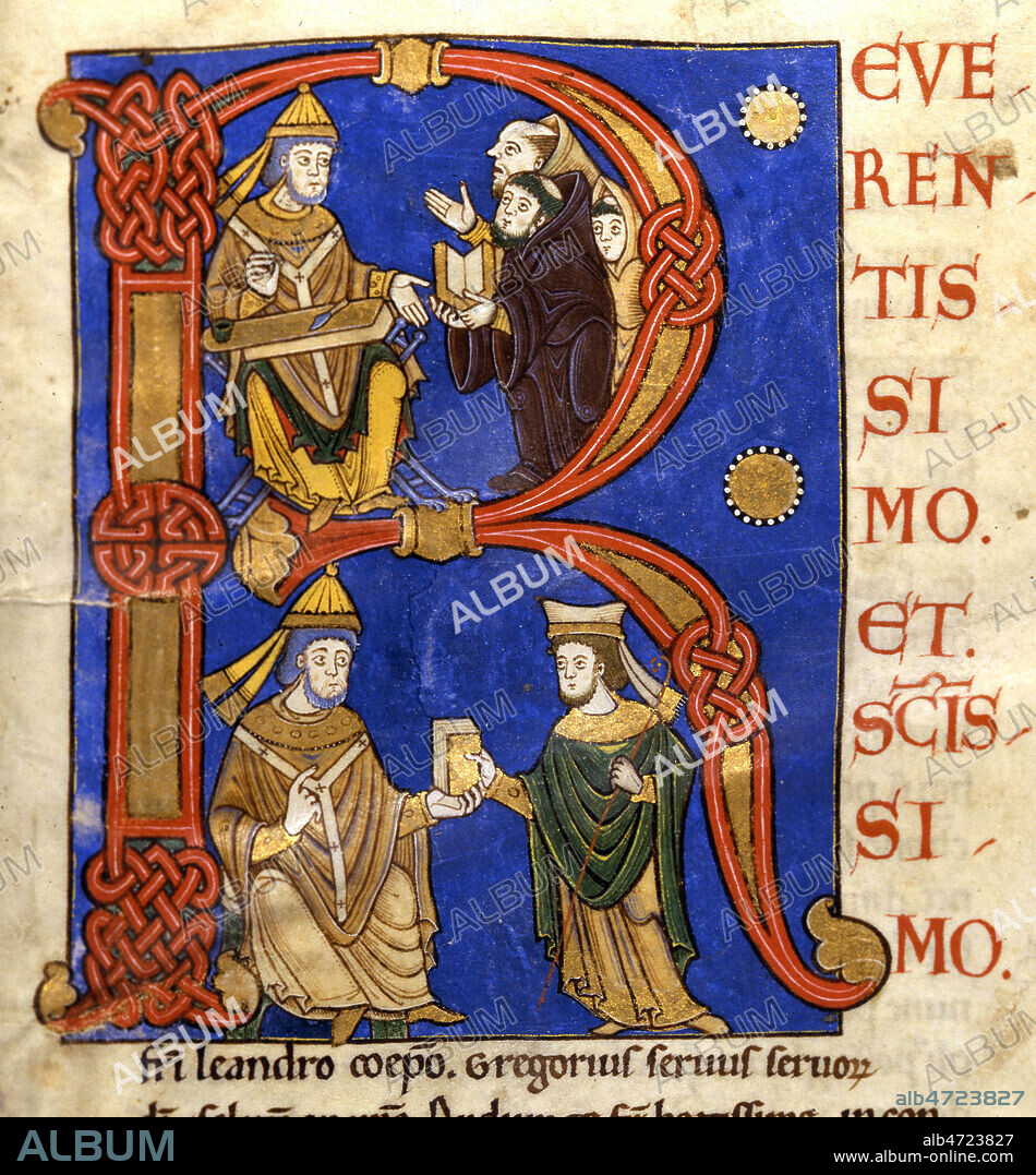 Lettrine ornee. En ht : trois moines presentent au pape Gregoire un livre aux pages vierges, ils lui demandent la mise par ecrit de ses conferences spirituelles sur Job tenues a Constantinople. Gregoire accepte, main ouverte, son materiel d'ecriture prepare. En bas : Gregoire remet un petit codex ferme a son ami Leandre qui avait encourage son entreprise. Enluminure tiree de 'Moralia in Job' par ST GREGOIRE. Manuscrit medieval conserve a la bibliotheque municipale de Tours. Credit : Coll. JeanVigne/KHARBINE-TAPABOR.