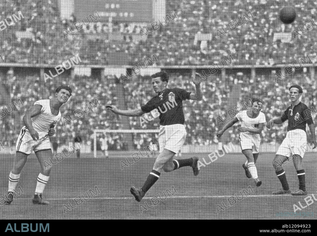 The changing picture in a handball game keeps the spectators glued: here Austria storm towards Hungary in a game in the intermediate round. - Berlin Olympics - 1936.