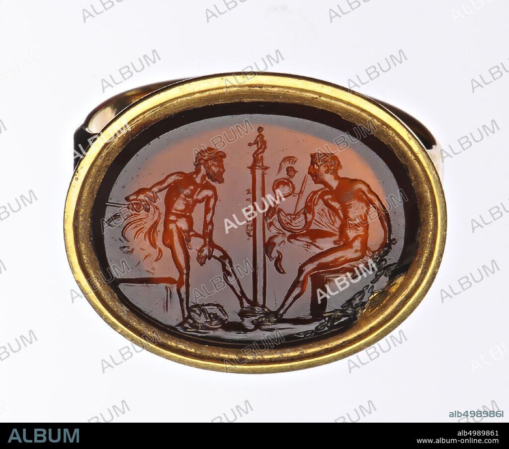 Vz: Diomedes on the right, sitting to the left with the Palladion in his left hand, standing facing him on the right, between them in a column, gem, intaglio, carnelian, Color: brown, Shape: oval, lying, Processing : in gold ring, type: 16 x 19 mm, D. 2.5 mm, wt. 5.7 gr., 18th century 1700-1800.
