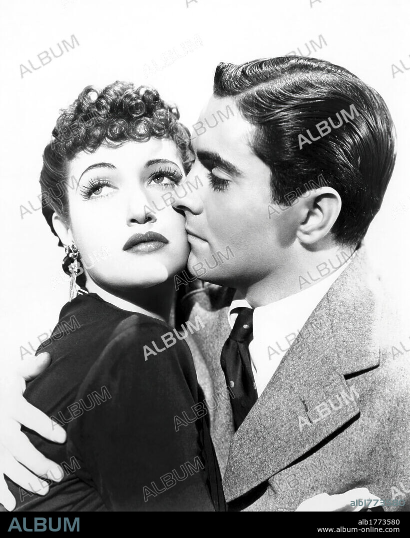 DOROTHY LAMOUR and TYRONE POWER in JOHNNY APOLLO, 1940, directed by HENRY HATHAWAY. Copyright 20TH CENTURY FOX.