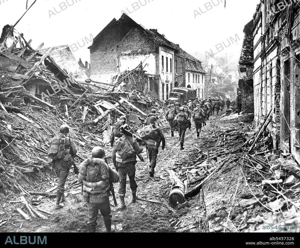 Ninth Army Infantrymen AdvanceInfantrymen of the U.S. Ninth Army advance through the ravaged gown of Linnich, Germany, after crossing the Roer River in their current Offensive. May 03, 1945. (Photo by Associated Press Photo).