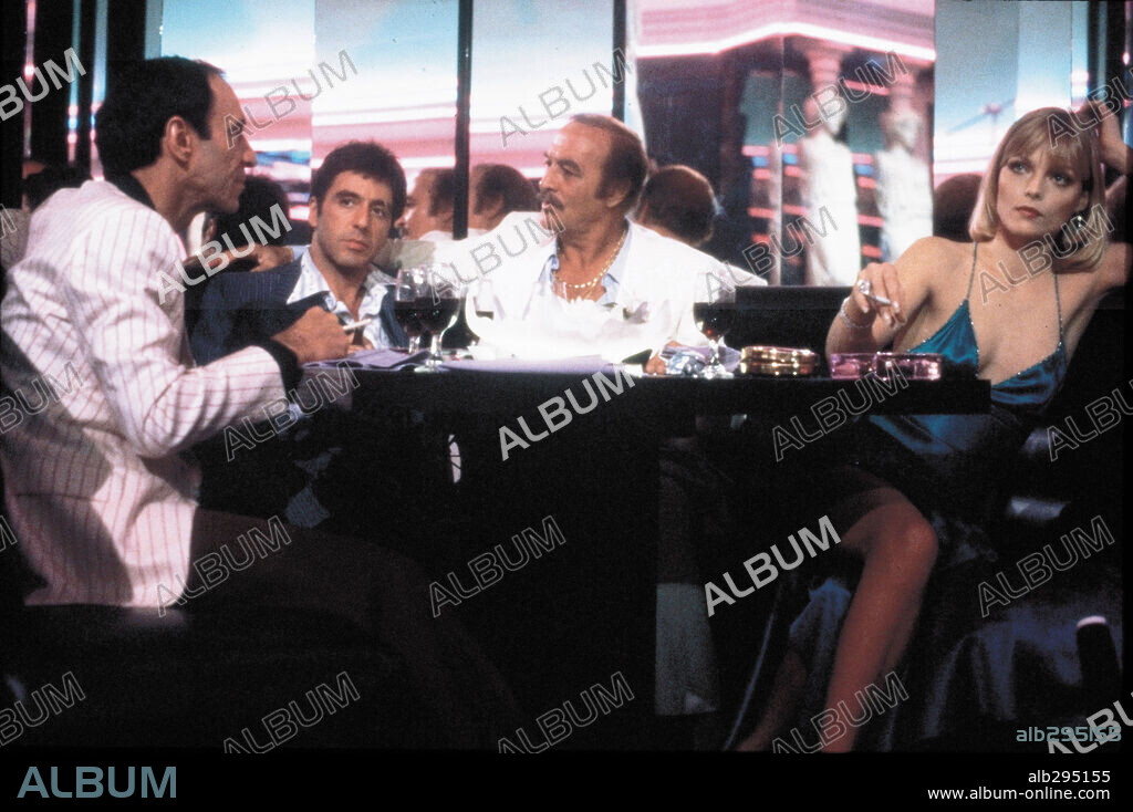 AL PACINO, MICHELLE PFEIFFER and ROBERT LOGGIA in SCARFACE, 1983, directed by BRIAN DE PALMA. Copyright UNIVERSAL PICTURES.