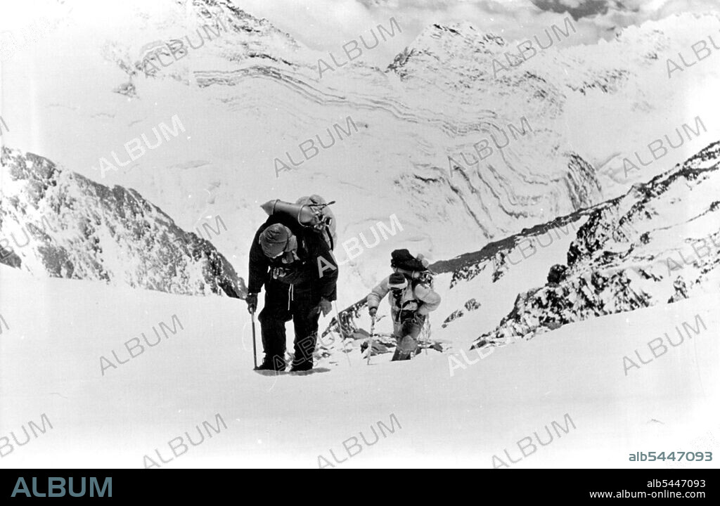 British Everest 1953 Expedition -- Two members of British Everest Expedition on their way up to the advanced camp. This is life the young Australian going to the mountaineering course hopes to emulate. June 19, 1953.