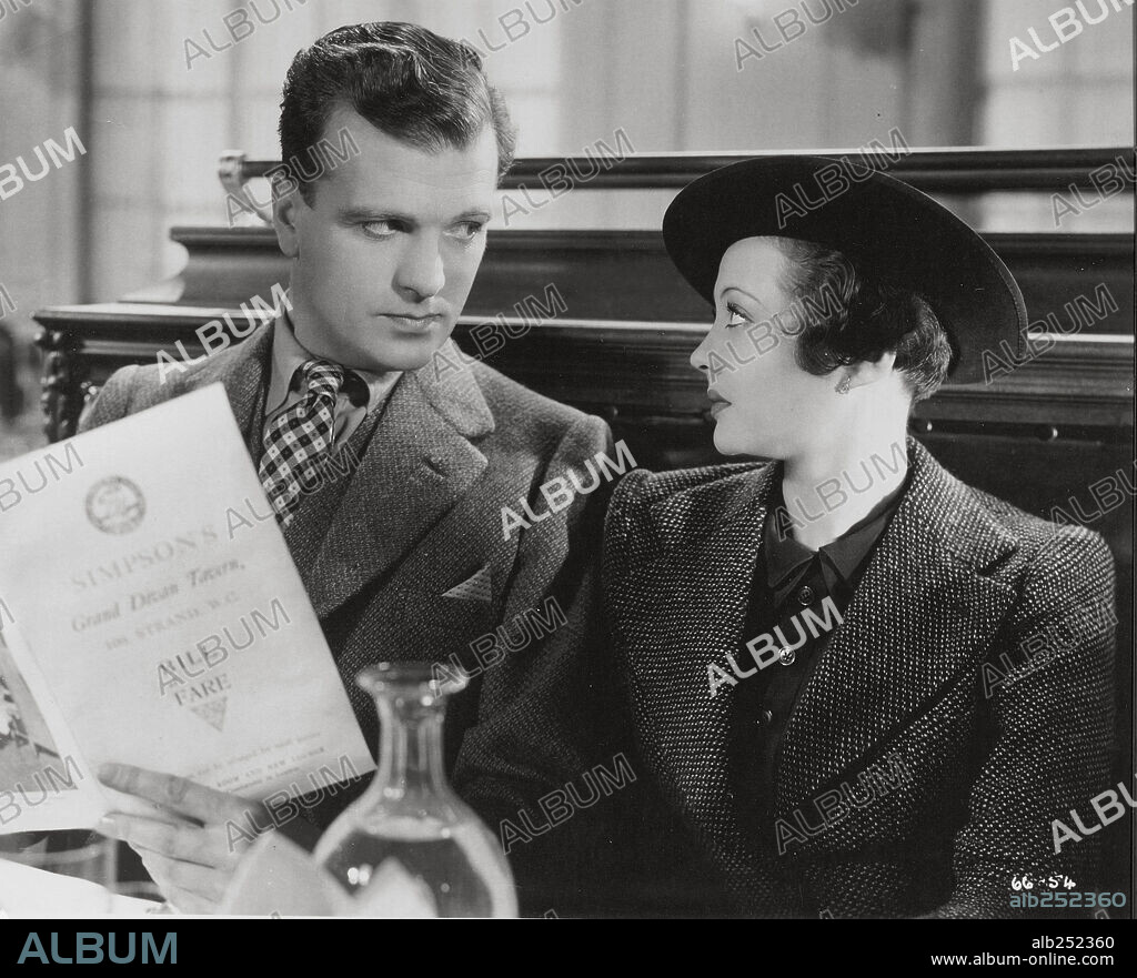JOHN LODER and SYLVIA SIDNEY in A WOMAN ALONE, 1936 (SABOTAGE), directed by ALFRED HITCHCOCK. Copyright GAUMONT-BRITISH.