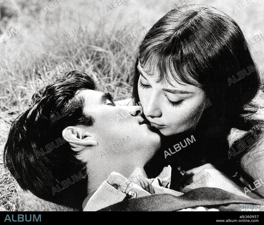 ANTHONY PERKINS and AUDREY HEPBURN in GREEN MANSIONS, 1959, directed by MEL FERRER. Copyright M.G.M.
