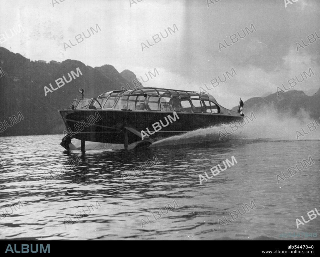 World' s Fastest Passenger Boat -- The Hydrofoil craft at speed during a demonstration run. Claimed by its inventor, Hans Von Schertel of Germany, to be the fastest passenger-carrying boat in the world, a 45-foot-long boat with wings was put through its paces on lake Lucerne, Switzerland, September 9. It covered 50 miles up and down the lake at 50 miles an hour with 32 passengers aboard. The Hydraulically-operated "Wings" lifted the main part of the craft out of the water shortly after it started, decreasing the water-drag by some 50%. The craft is powered by a 350HP diesel engine driving a normal screw. It is claimed that the boat could cross from France to Dover in rough water in only 30 minutes. September 11, 1952. (Photo by Associated Press Photo).