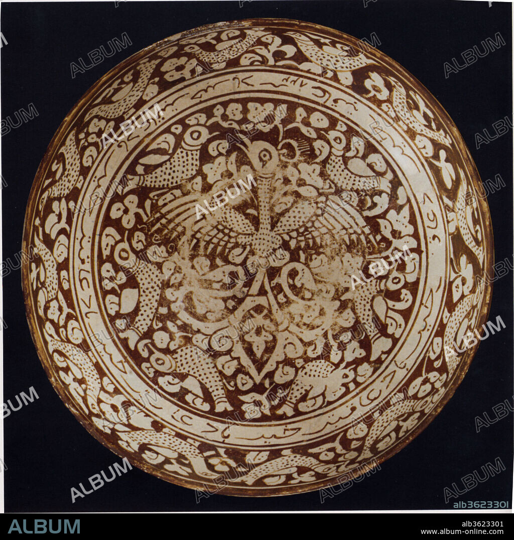 Bowl with Repeating Persian Inscription Wishing for Good Fortune. Dimensions: Diam. 11 1/4 in. (28.6 cm)
H. 4 7/8 in.  (12.4 cm). Date: dated A.H. 822/ A.D. 1419-20.
Luster production reach its apex in Iran during the medieval period.  Later, under Timurid rule, blue and white ceramics in imitation of Chinese examples were favored and produced in large quantities.  This luster-glazed stonepaste bowl, dated A.H. 822/A.D. 1419, demonstrates a continuation of luster ceramic production into the fifteenth century in Kashan.  A repeating blessing which translates to "may the end be good" or "may you have good fortune" frames an out-spread bird or heraldic phoenix.  The exterior of the bowl is decorated with a continuous pattern of lotus leaves, suggesting a Chinese influence.