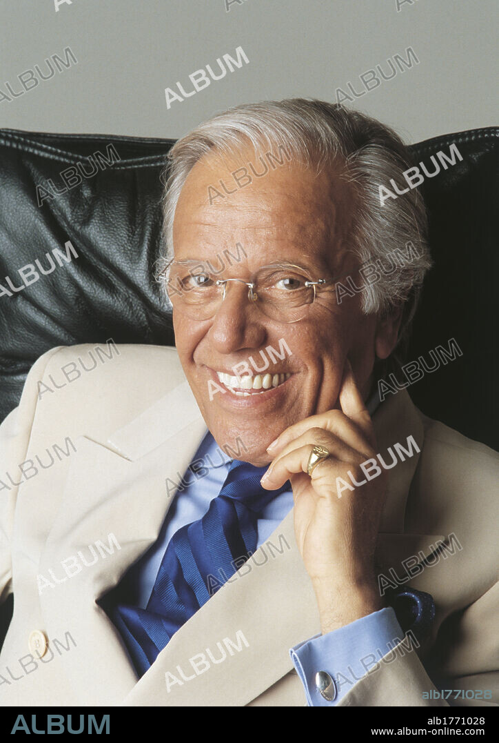 Gianfranco Funari in an armchair. Italian anchorman and columnist Gianfranco Funari seated. 2000.