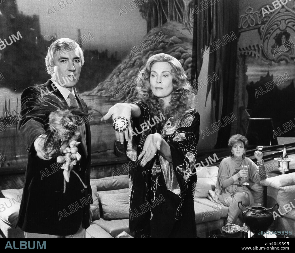 Peter Cook (1933-94) and Faye Dunaway (1941- ), in a scene from the motion picture 'Supergirl', 1984.
