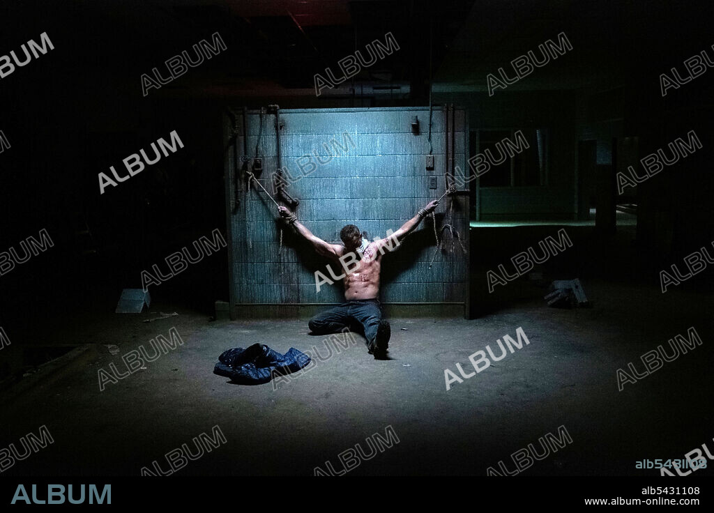 CHRIS WILLIAM MARTIN in DEMONIC, 2021, directed by NEILL BLOMKAMP. Copyright AGC STUDIOS.