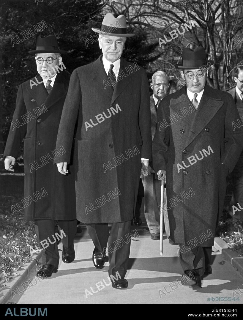Washington D.C.:  November 17, 1941. Saburo Kurusu, (right) Japan's special envoy for a 'final attempt at peace', Secretary of State Cordell Hull, and Kichisaburo Nomura, (left) Japanese Ambassador to the United States, arrive at the White House for a 70 minute conference with President Roosevelt. The President told them that he hoped a major conflict in the Pacific could be avoided.