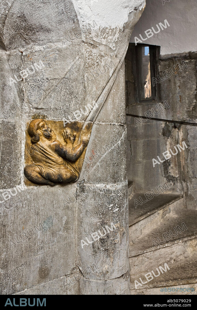 Genoa, Duomo (St. Lawrence Cathedral), stairs leading to te bell tower: Telamon supporting the Ceiling, 1225, by Master of the lunette of the Genoa Cathedral.