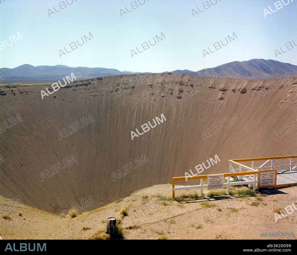 Sedan Crater is a 1,280 by 320 foot crater was created on July 6, 1962 by a 104-kiloton-of-TNT (440 TJ) nuclear explosion. The device was buried 635 feet below the desert floor in Area 10 of Yucca Flat and was the largest cratering shot in the Plowshare Program. The explosion created fallout that affected more US residents than any other nuclear test, exposing more than 13 million people to radiation and marked the end of the program. The crater was listed on the National Register of Historic Places on March 21, 1994. The crater can be seen from earth orbit with the unaided eye. Operation Storax was a series of 47 nuclear tests conducted by the United States in 1962-1963 at the Nevada Test Site. Sedan was one of the most spectacular nuclear test ever fired in the continental United States. It was an LRL test conducted under the auspices of the Plowshare program, which was an attempt to develop non-military uses for nuclear explosives. The purpose of Sedan was to investigate the potential of "clean" thermonuclear devices for producing large craters cheaply. Look to the size of the roads in the bottom-right of the picture, and the observation deck at the lower-right edge of the crater, for a sense of scale. AKA Project Plowshare was the overall United States term for the development of techniques to use nuclear explosives for peaceful construction purposes.