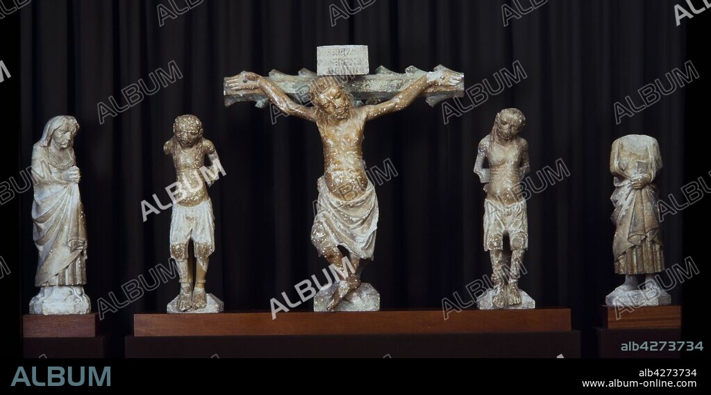 MAESTRO BARTOMEU. Mestre Bartomeu / Conjunto de Calvario formado por Cristo clavado en la cruz, San Juan, la virgen María y los dos ladrones. Piedra policromada, siglo XIII.