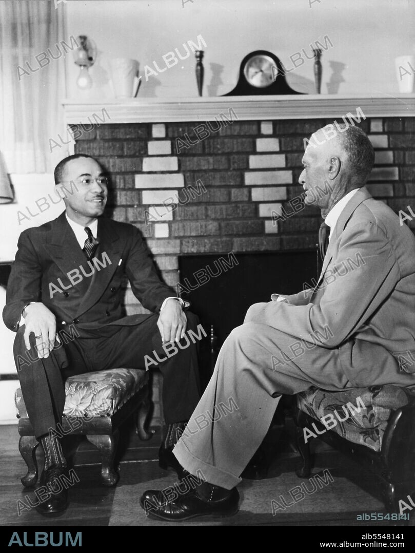 GORDON PARKS. Winter Park, Florida. Mr. James A. Colston, youthful president of Bethune-Cookman College, talking with his father about the administrative problems.