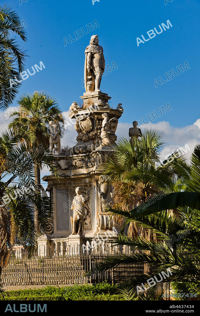 Palermo, the Parliament Square: The Marble Theatre, monument to Philip V, facing The royal Palace or Palace of the Normans. It was realised by Gaspare Guercio, Carlo D'Aprile and Gaspare Serpotta to celebrate the glory of Philip IV of Habsburg, king of Spain and Sicily, called Philip the Great.. Around the pedestal the four parts of the Earth known at that time (Europe, Asia, Africa and America), on which the king of Spain ruled, are depicted. On the first level there are the statues of the four Moors, or the previous kings of the countries that went under his domination. The work is adorned with plaques and coats of arms of the most important families in Sicily. The original statue of Philip IV was destroyed during the Sicilian revolution in 1848 and was replaced in 1856 by the current marble statue representing King Philip V of Spain and was realised by Nunzio Morello.. Detail.