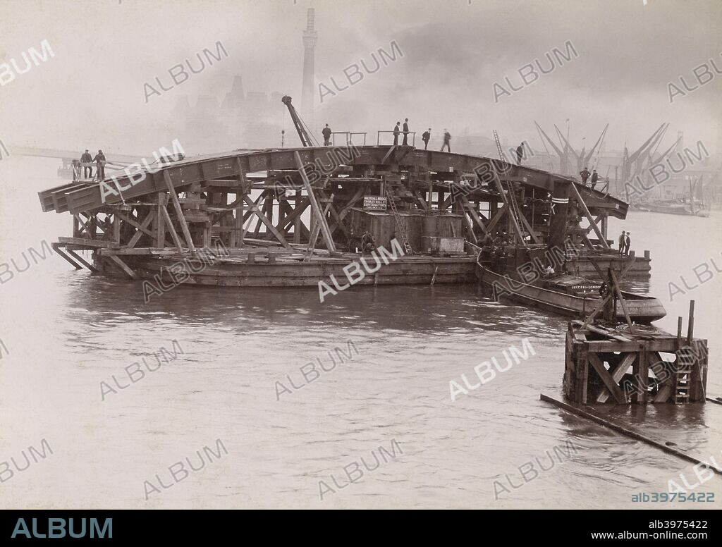 Construction of Vauxhall Bridge, London, 1903-1904. Barges manoeuvring one of the steel arches which would form the new Vauxhall Bridge into place on the River Thames. The new Vauxhall Bridge was opened on 26 May 1906, and replaced an earlier bridge constructed in 1811-1816.
