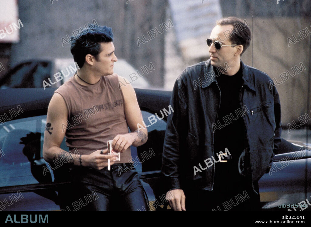 JOAQUIN PHOENIX and NICOLAS CAGE in EIGHT MILLIMETER, 1999 (8MM), directed by JOEL SCHUMACHER. Copyright COLUMBIA PICTURES / FACTOR, DAVIS.