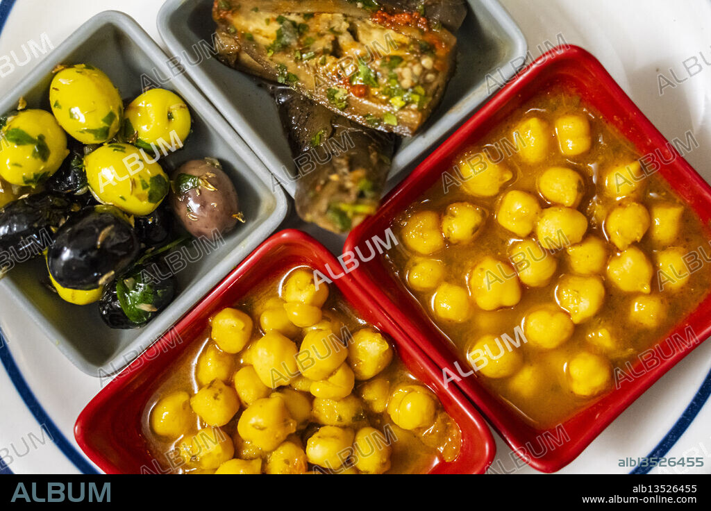dish with chickpeas, olives and eggplant, typical Moroccan tapa,Tangier, Morocco, North Africa.