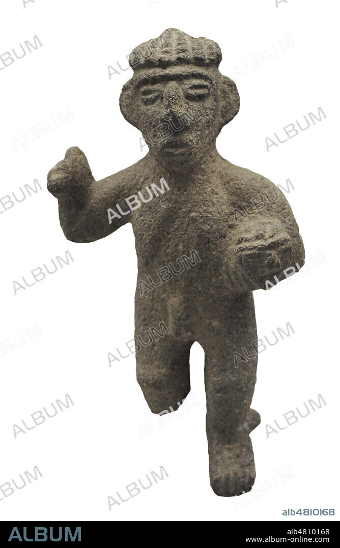 Sculpture representing a warrior with an axe and a trophy head. Stone. Atlantic Slope (1000-1500 AD). Costa Rica. Museum of the Americas. Madrid, Spain.