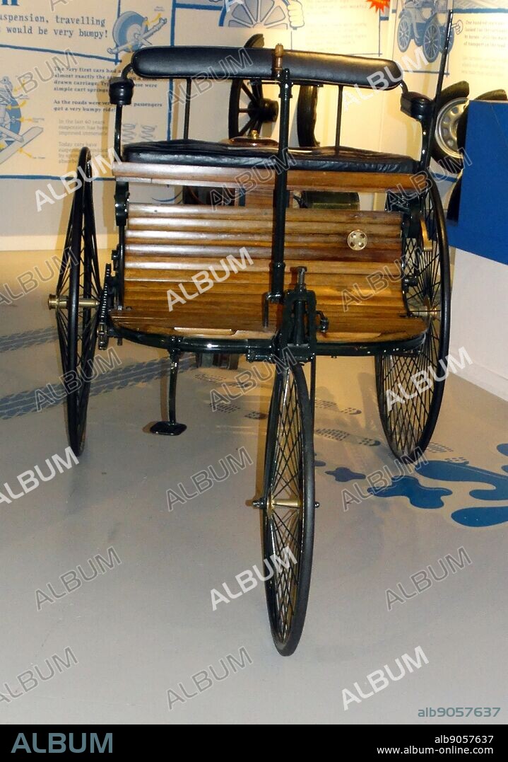 Replica of the world's first motor car which was built in 1886 by Karl Benz in Mannheim, Germany. It was powered by a single cylinder engine beneath the street.