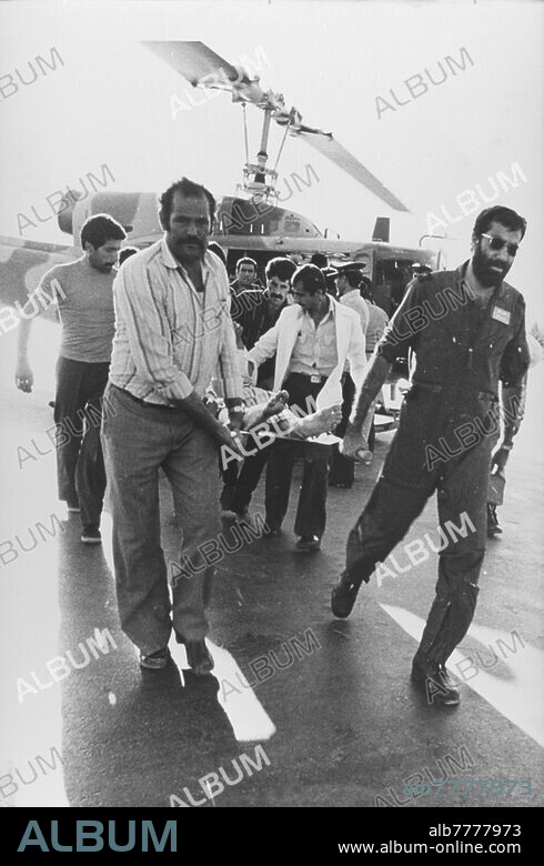 Iran-Iraq war (22.09.1980 - 20.08.1988) / Battle of Khorramshahr / destruction of the war. The city of Khorramshahr in Iran, located about 40 kilometers southeast of Basra in Iraq, has been at the center of events since the beginning of the war. The Battle of Khorramshahr, which lasted seven weeks from September 22 to November 10, 1980, left a ghost town that was renamed "Khuninshahr" meaning "City of Blood." Transport of an injured person who was evacuated from the combat area by a rescue helicopter. Photo, 02.10.1980.