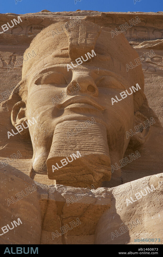Egyptian art. Great Temple of Ramses II. Colossal statues depicting the pharaoh Ramses II (1290-1224 BC) seated with the nemes head and surmounted by the double crown. 19th Dynasty. New Kingdom.  Abu Simbel. Egypt.