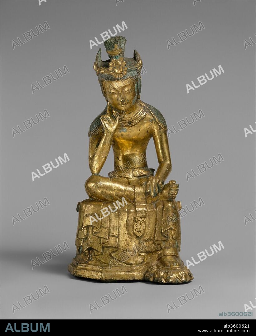 Pensive bodhisattva. Culture: Korea. Dimensions: H. 8 7/8 in. (22.5 cm); W. 4 in. (10.2 cm); D. 4 1/4 in. (10.8 cm). Date: mid-7th century.
Images of the pensive bodhisattva became prevalent in East Asia between the fifth and eighth centuries. In Korea, the type emerged as an important Buddhist icon during the sixth and seventh centuries, particularly in the kingdoms of Baekje and Silla. This seated figure is among the best-preserved examples. It is infused with a subtle yet palpable energy that is articulated in such details as the pliant and lifelike fingers and toes. His crown is topped with an orb-and-crescent motif, indicating Central Asian influence.