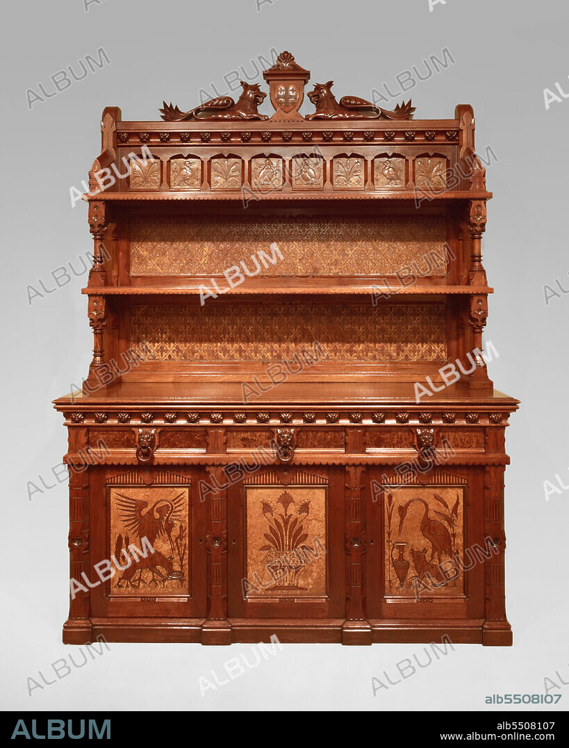 DANIEL PABST. Sideboard, 1868/80. Large walnut sideboard with two shelves, animal designs on doors, gryphons at top.
