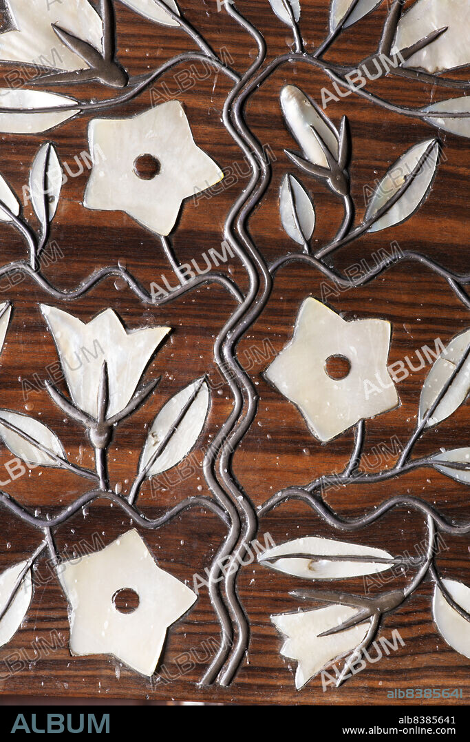 JAMES O DAVIES. St Andrew's Church, Talbot Road, Roker, Sunderland, 28-07-2019. Detail of the mother-of-pearl and silver inlay on a lectern in St Andrew's Church, with a floral design by Ernest Gimson.