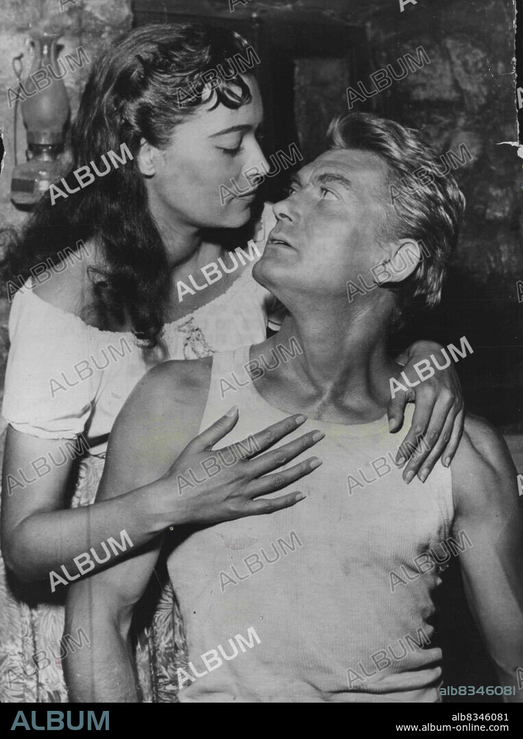 Gipsy Girl -- Kerima and Jean Marais in the ***** yesterday.The beautiful film actress Kerima, plays the part of a gipsy in the film" "Goubbiah" co-starring with Jean Marais.Kerima and and Jean Marais visited Yugoslavia recently for the filming of the outdoor scenes and when the rest of the cast returned to Paris, Kerima stopped off in Rome for a few weeks holiday.Holiday over she has returned to the Paris film studios to continue shooting scenes for the film. October 18, 1955. (Photo by Paul Popper Ltd.).